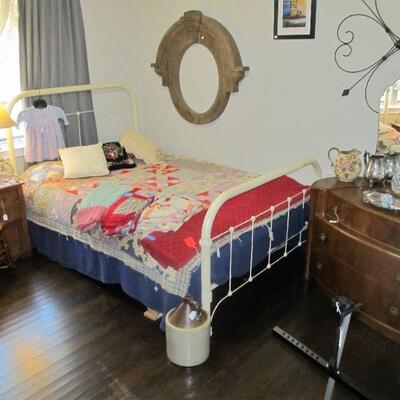 Antique Victorian cast-iron metal full-size bed w/ antique quilt & quilt tops. 2 antique Art deco dressers.