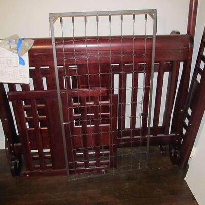 Solid oak baby crib that converts into 4 different beds.