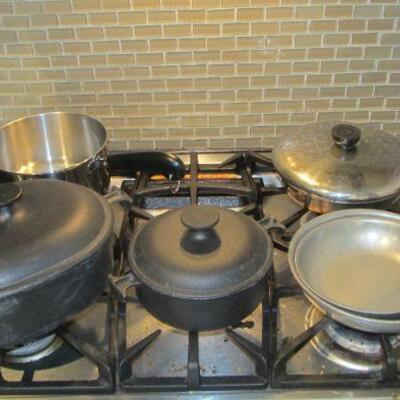 Vintage LaCreuset cast-iron & other cute stainless steel pans.