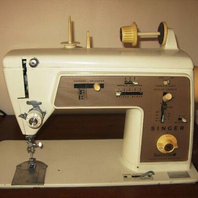 Singer sewing machine with cabinet  BUY IT NOW $ 85.00