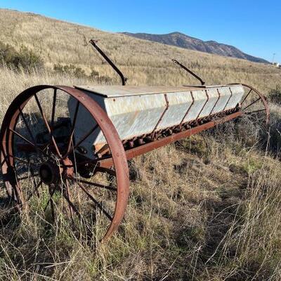 #2002 â€¢ Vintage Seed Spreader: Measures Approx: 166â€ Wide Wheels Are Approx: 45â€