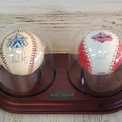 Nolan Ryan Autographed Baseballs Under Glass
And on Wooden base. 1995 All Star Game. #48/500