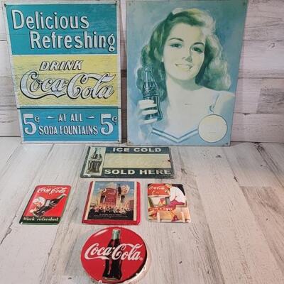 (7) Coke: 3-Metal Signs, 3-Wall Light Covers, 1-Ceramic Plaque