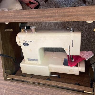 sewing machine in cabinet