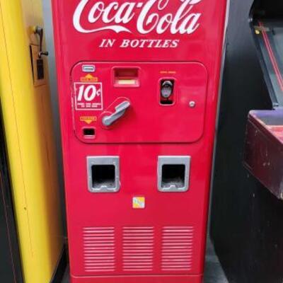 #126 â€¢ Vintage Coca-Cola Bottle Dispenser. Measures approx 17