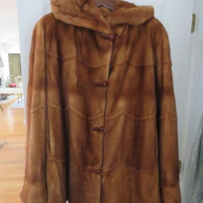 Hooded fur jacket with bakelite closures