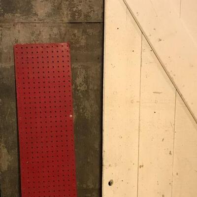 Red pegboard panel