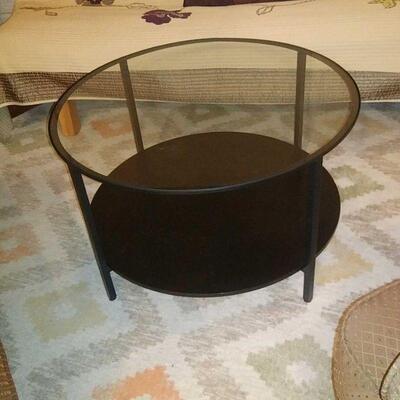 round iron and glass table
