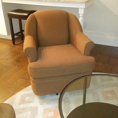 one of pair of swivel club chairs