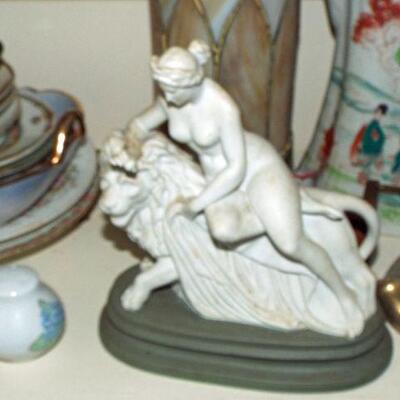 FRENCH BISQUE WOMAN RECLING ON LION FIGURE