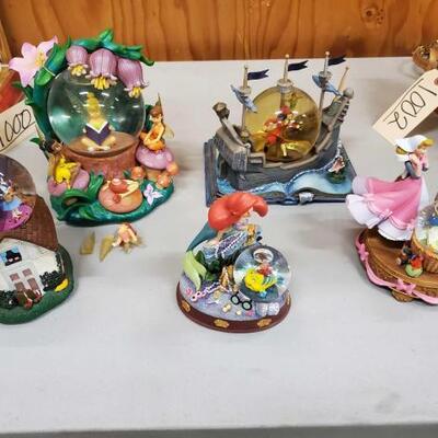 #1004 • 4 Disney Snowglobes And Wizard Of Oz Snow Globe. Measurements Range Approx 8
