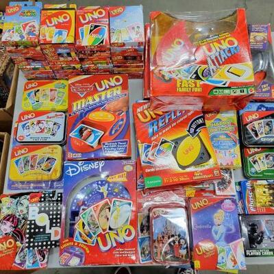 #1508 • Assortment of Themed Uno Playing Cards. Themes Include The Simpsons, Disney, Super Mario, Spongebob, Coco, Cars, Hannah Montana,...