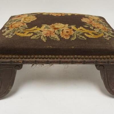 1086	CARVED UPHOLSTERED STOOL W/ BRASS CLAW FEET. 24 1/4 IN X 11 1 /4 IN AT THE SPLAYED FEET
