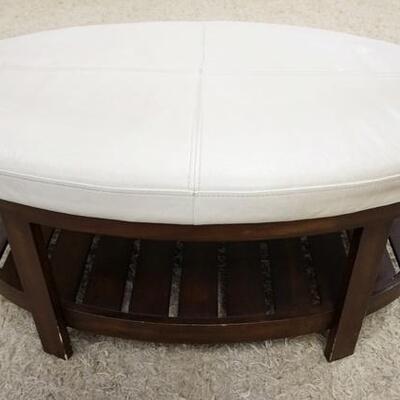 1048	UPHOLSTERED STOOL/BENCH W/ A BOTTOM SHELF. 44 IN X 27 IN, 19 IN H 
