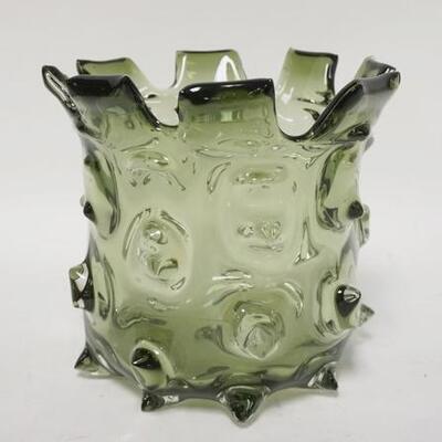 1075	GREEN BLOWN GLASS VASE W/ PULLED OUT HOBNAILS CHIP ON THE LOWER PROTRUSION . 7 1/4 IN H 
