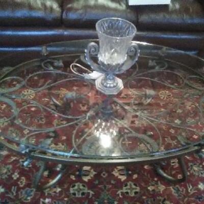 Glass top coffee table with metal base