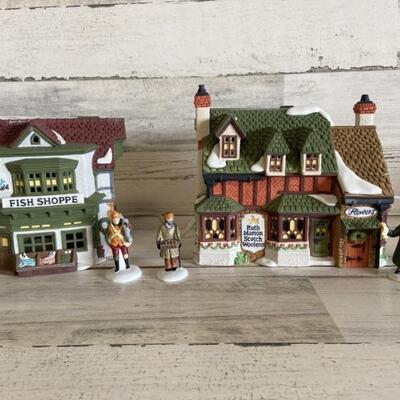 (4) Heritage Village Collection Dicken's Village:
Ruth Marion Scotch Woolens, The Mermaid Fish Shoppe ( with working light) , The Town...