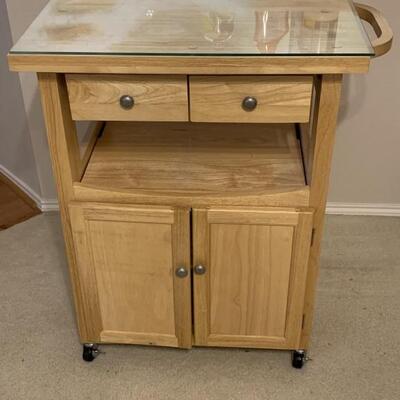 Rolling Kitchen Island has Storage & a Glass Top