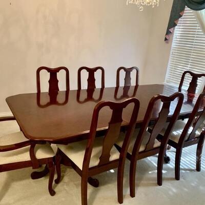 Cherry Two Pedestal Dining Table with 8 Chairs
Comes with 2 Leaves & 8 Table Pads
There are 2 Armchairs & 6 Side Chairs
Matches Sideboard...