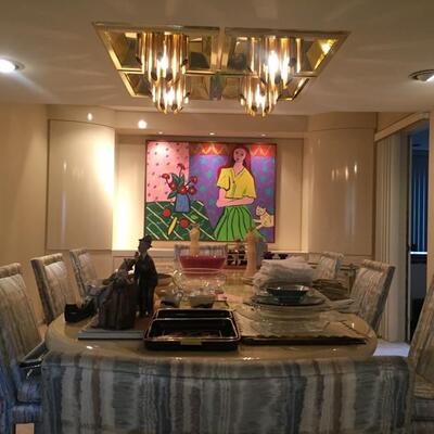 The art piece pictured above is not for sale. Dining room table and items on it are for sale.