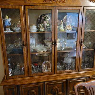 Beautiful dining room Hutch with glass shelves and lights, matches table and chairs