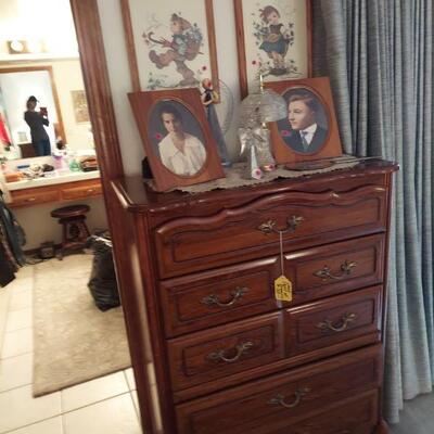 Chest of drawers $150.  Framed photos have been removed by family