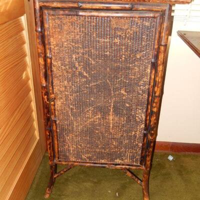 Bamboo and wicker cabinet with wood shelves - damage to wicker - $85 