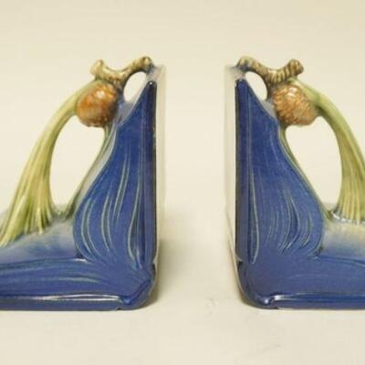 1015	PAIR OF ROSEVILLE BLUE PINECONE BOOKENDS. ONE BOOKEND HAS TWO SMALL FLAKES. 4 3/4 IN H 5 1/2 IN W
