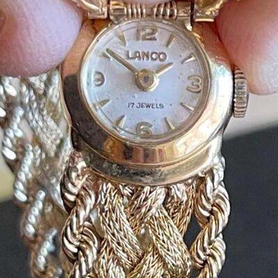 Solid 14k gold Lanco watch with 17 jewels and diamond on flip cover