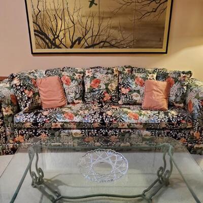 Sofa, glass and wrought iron coffee table, Franklin Mint Japanese Byobu screen.