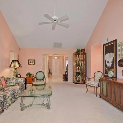 Sofa, coffee table, Scott Copley console, curio cabinet, wall prints, lamps, etc.