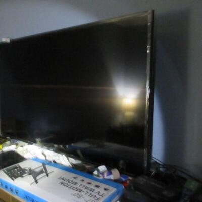 Large flat screen TV, wall mount, DVD player