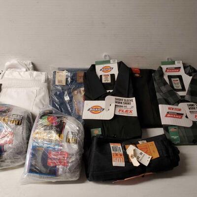 #5204 â€¢ 4 Pairs Of Pants, 2 Button Up Shirts, And 2 Packs Of Socks