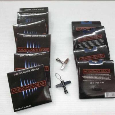 #2564 â€¢ (10) Packs of Electric Guitar Strings & Tools