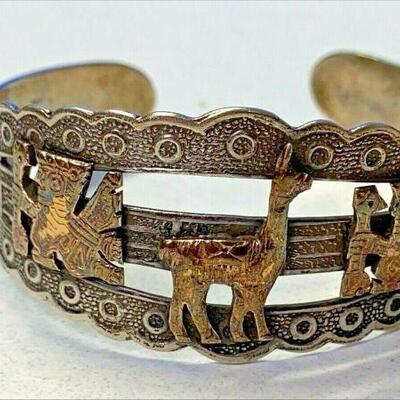 https://www.ebay.com/itm/115149172721	NC596 PERUVIAN CUFF STERLING SILVER BRACELET WITH 18 K GOLD INCAN ART INLAY		 Offer 	 $199.99 
