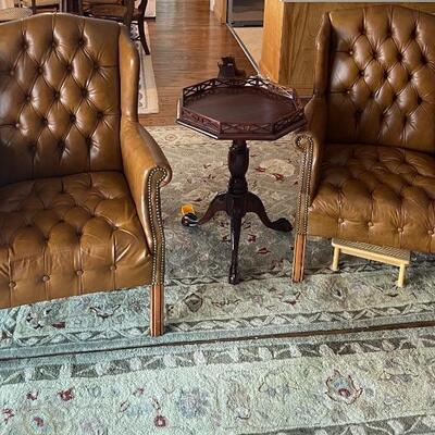 Leather wingback chairs and large area rug 