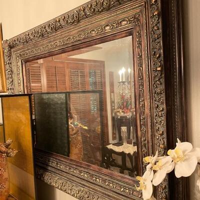 Large rectangular ornately framed mirror