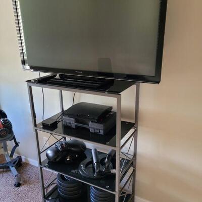 another tv, and weights and a shelf unit all sold separately