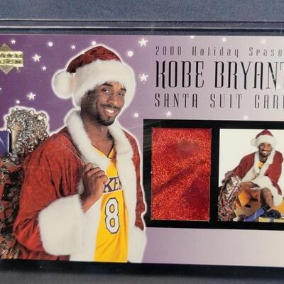 Kobe Bryant, 2000 Holiday Santa Suit Card
Piece of Santa Suit that was worn by Kobe Bryant
