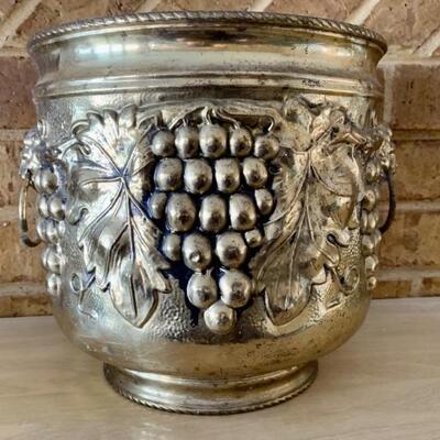 Cast Brass-Tone Urn Planter with Vining Grapes &
Lions Head Ring Handles 
Piece is Lightweight