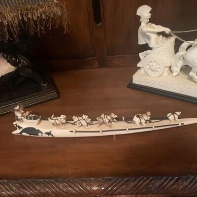 Hand carved ivory tusk with snow sled