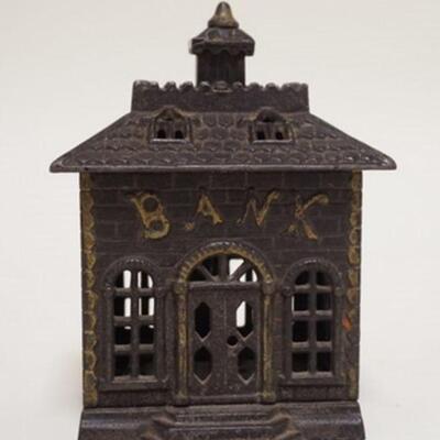 1052	*BANK* STILL BANK, CAST IRON, 4 1/4 IN WIDE X 5 5/8 IN HIGH

