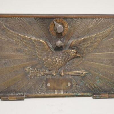 1065	BRASS PO BOX DOOR W/SPREAD WING EAGLE MOUNTED TO A STAND, 11 IN X 6 1/4 IN
