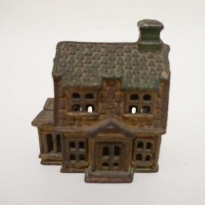 1019	HOUSE STILL BANK, GREEN & GOLD DECORATION, CAST IRON, 2 3/4 IN WIDE X 3 1/8 IN HIGH
