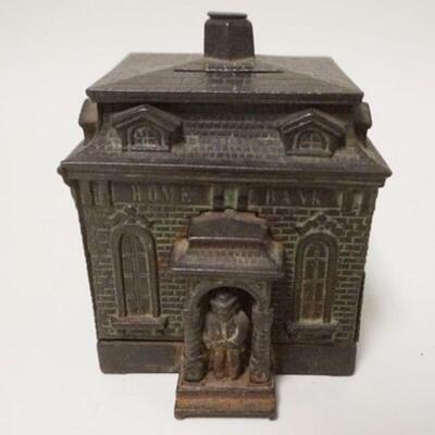 1040	*HOME BANK* BUILDING STILL BANK W/MAN IN DOORWAY, CAST IRON, 3 5/8 IN WIDE X 4 1/4 IN HIGH
