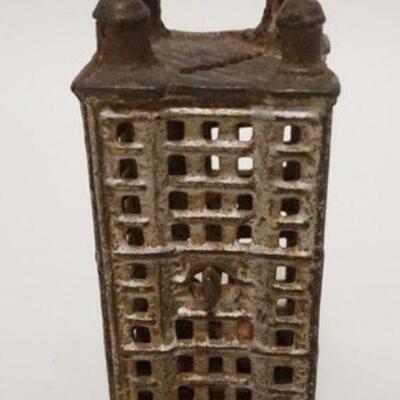 1038	BUILDING STILL BANK, CAST IRON, 2 1/4 IN SQUARE X 4 1/2 IN HIGH
