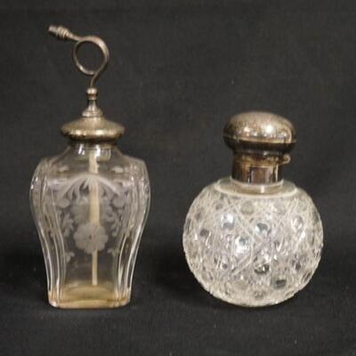 1110	2 CUT GLASS PERFUME BOTTLES, ONE HAS AN ENGLISH STERLING SILVER CAP & CORK STOPPER, OTHER IS AN ATOMIZER W/STERLING SILVER TOP & HAS...