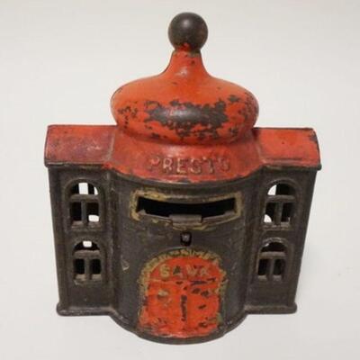 1026	*PRESTO BANK* BUILDING STILL BANK, ALSO MARKED *PAT APD*, RED DECORATION, HAS SPRING BUTTON, CAST IRON, 3 3/4 IN WIDE X 4 1/2 IN HIGH
