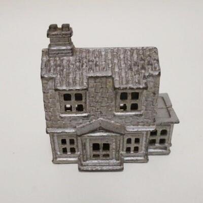 1028	HOUSE STILL BANK, SILVER DECORATION, CAST IRON, 4 IN WIDE X 4 1/4 IN HIGH
