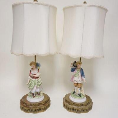 1075	PAIR OF FIGURAL PORCELAIN LAMPS W/PIERCED BRASS BASES, HAVE CLOTH SHADES & ORIGINAL FINIALS, CORDS HAVE BEEN CUT, 28 IN TOTAL HEIGHT
